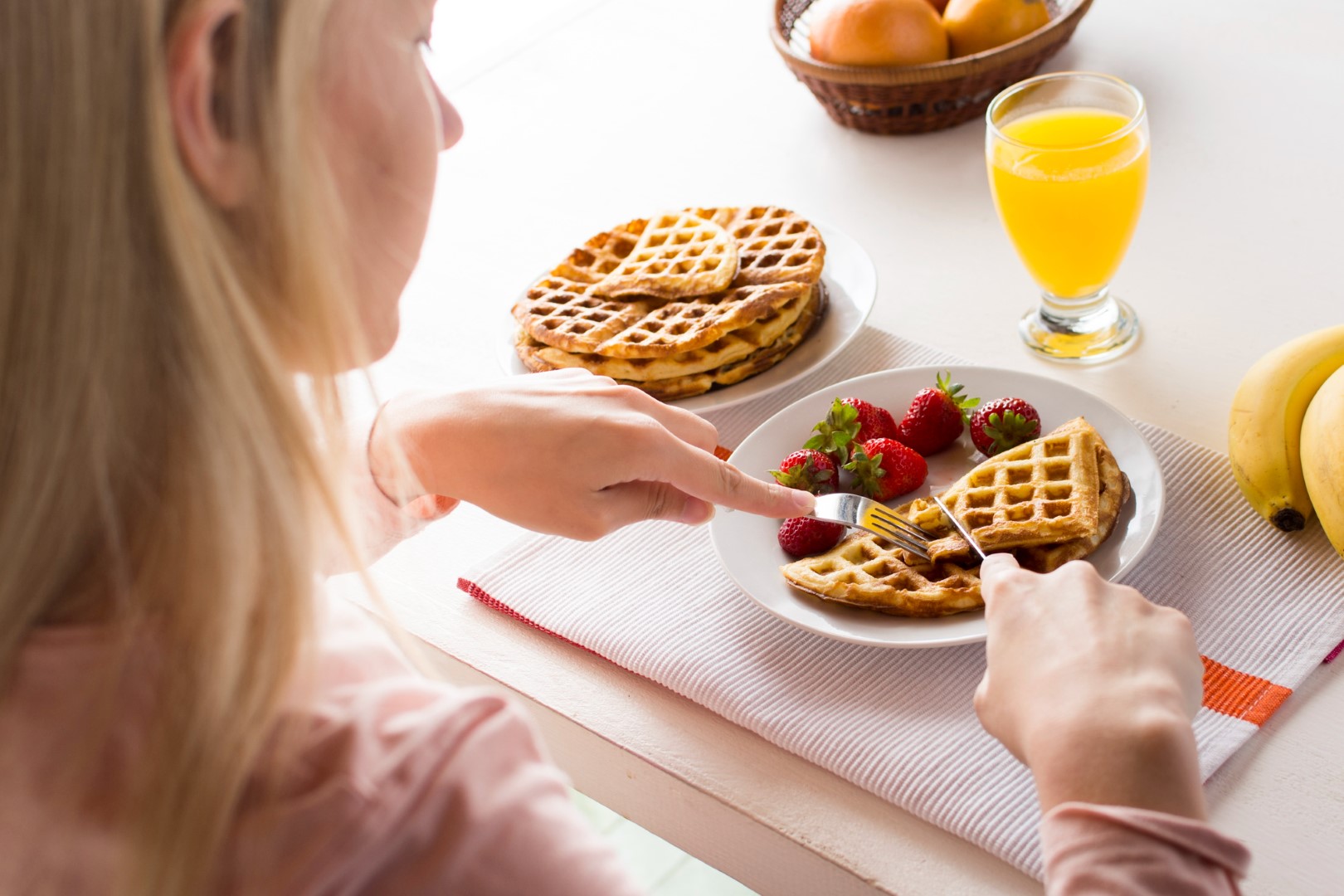 waffle with juice Woman outdoor at summer sunset time having ice cream cone positive happy playful at city street