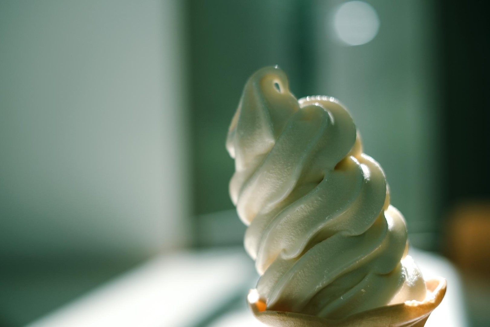 ice cream close up Woman outdoor at summer sunset time having ice cream cone positive happy playful at city street