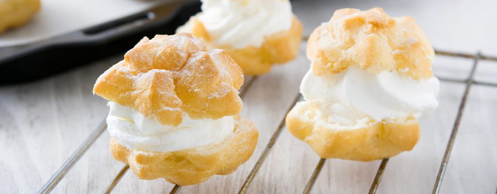 fresh-profiteroles-with-cream (1) high-angle-view-breads-tomatoes-burlap (Custom)